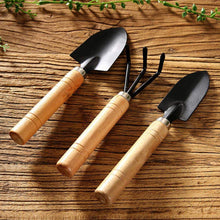 Small hand cultivator, trowel, and garden fork set, perfect for home gardening.